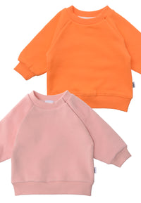 nahaufnahme von den 2 Sweatshirts in rosa und orange