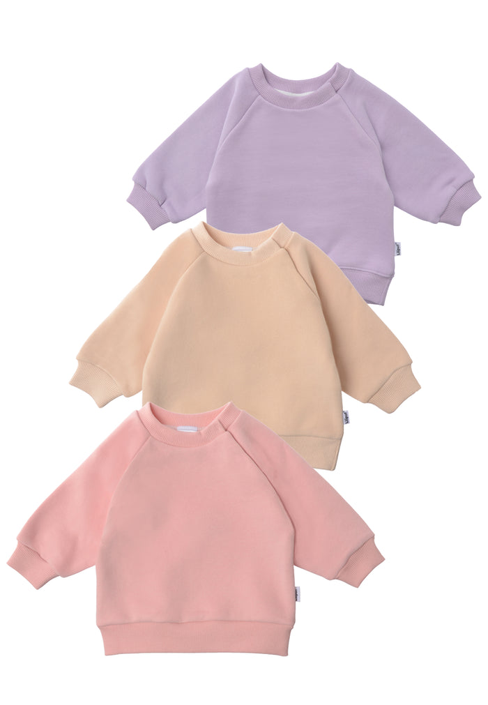 vorderseite von den 3 Sweatshirts in beige, rosa und flieder