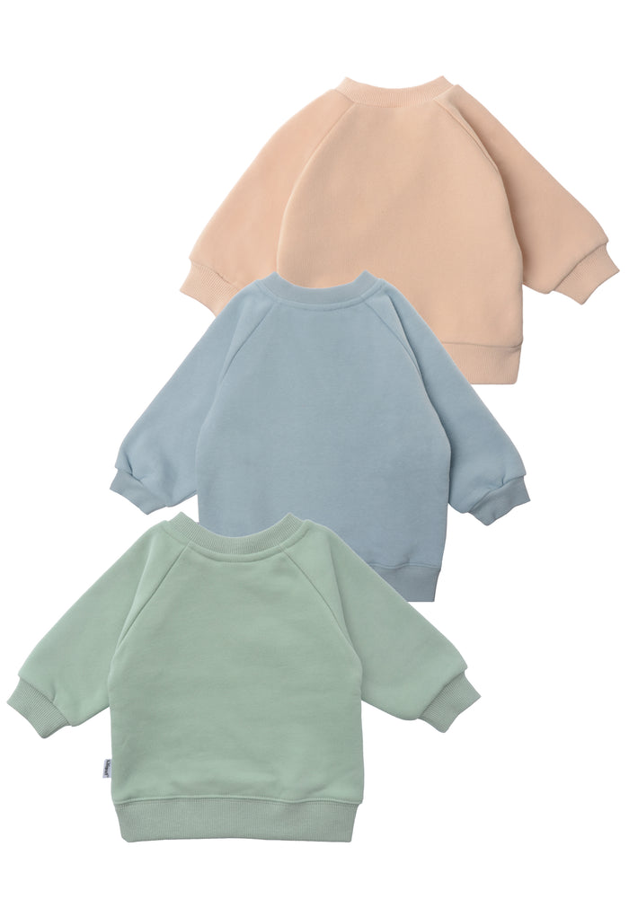 rückseite von den 3 Sweatshirts in beige, schilf und hellblau