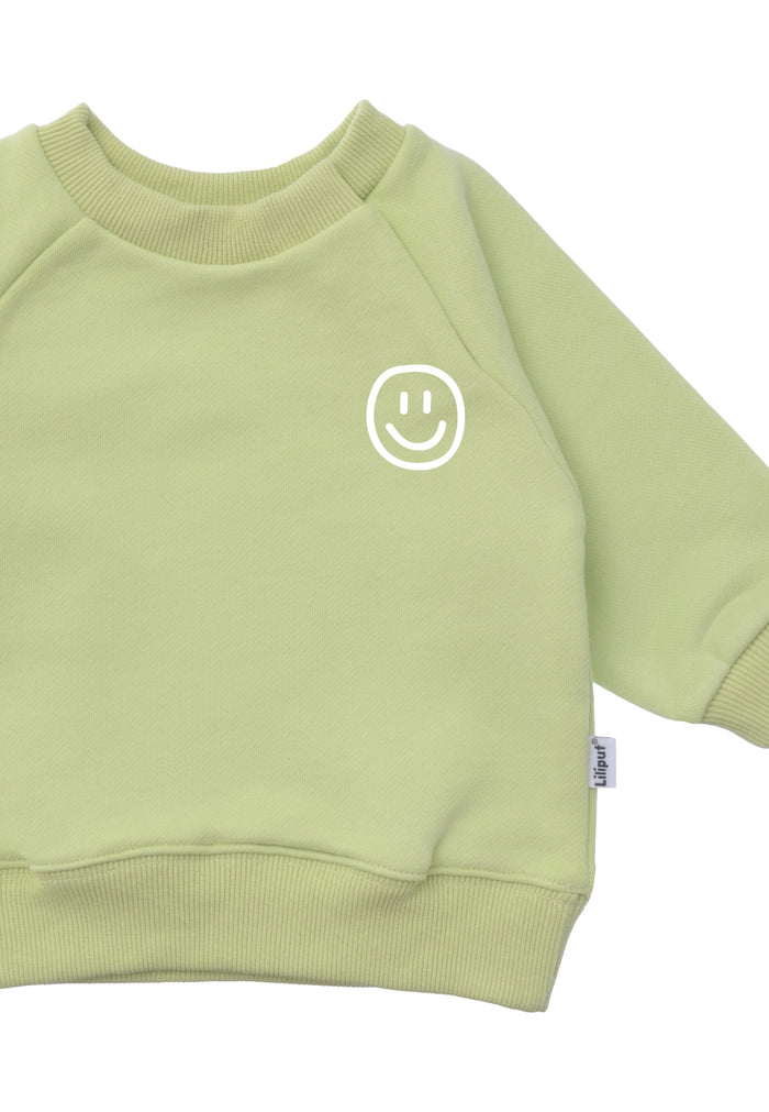 Im Detail Sweatshirt in der hellgrün mit "smily" Print