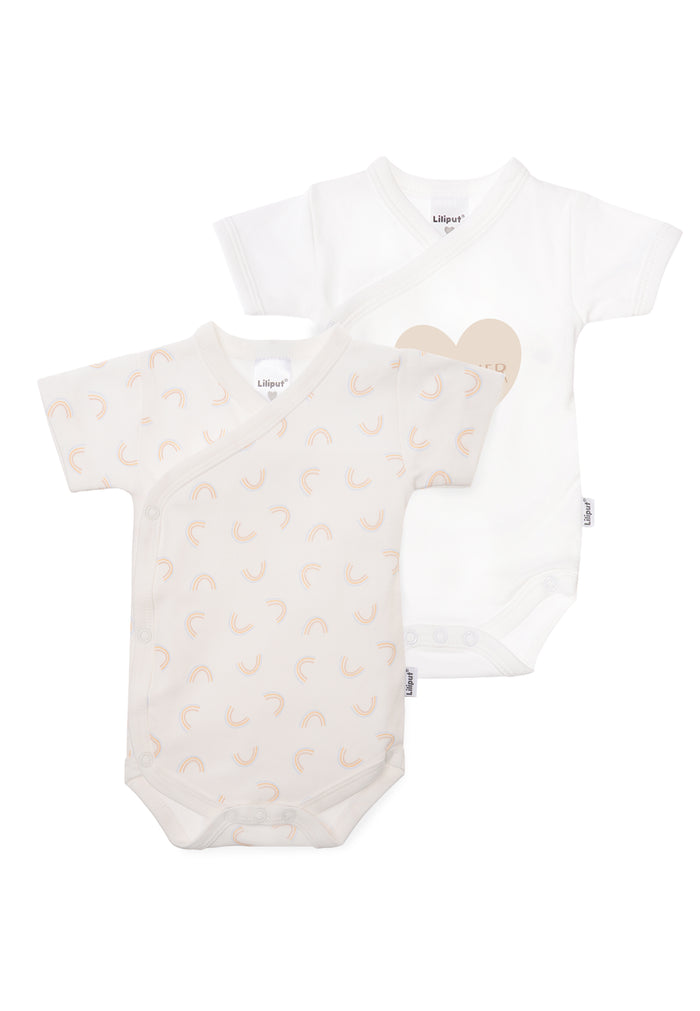 Doppelpack Wickelbodys in weiß mit Print little dreamer und 1x mit Aufdruck Regenbogen.