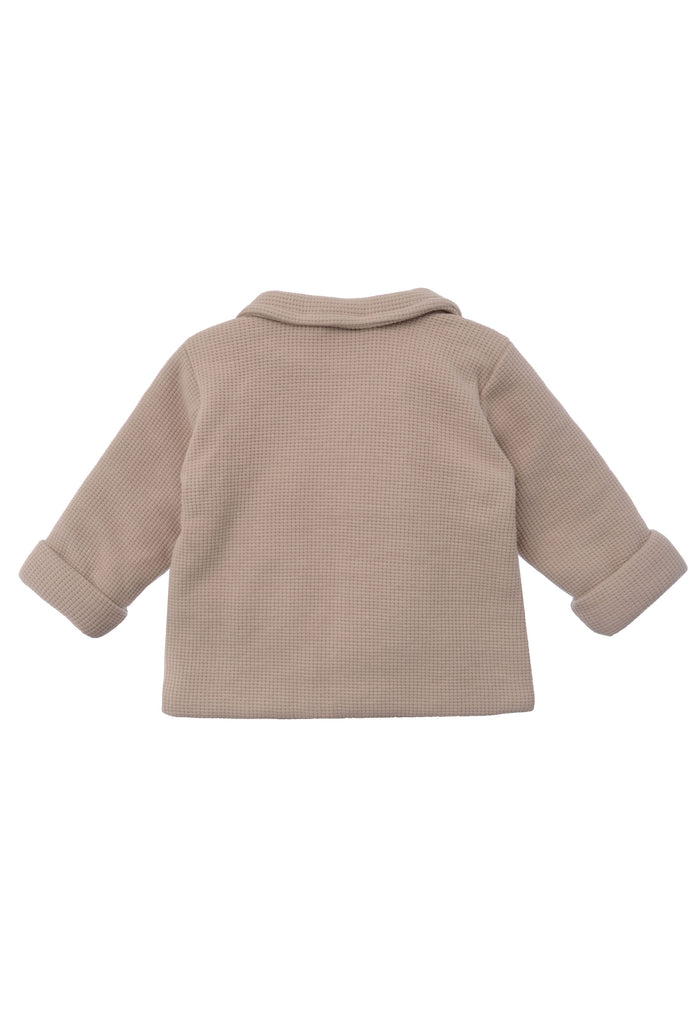 Rückseite der hochwertigen Waffelpique Jacke in beige.
