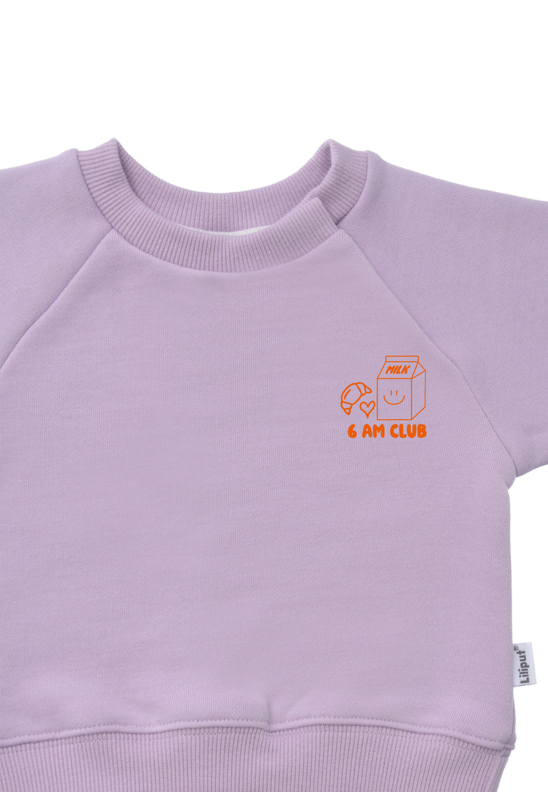 Detailansicht des orangenem 6am Club Prints. 