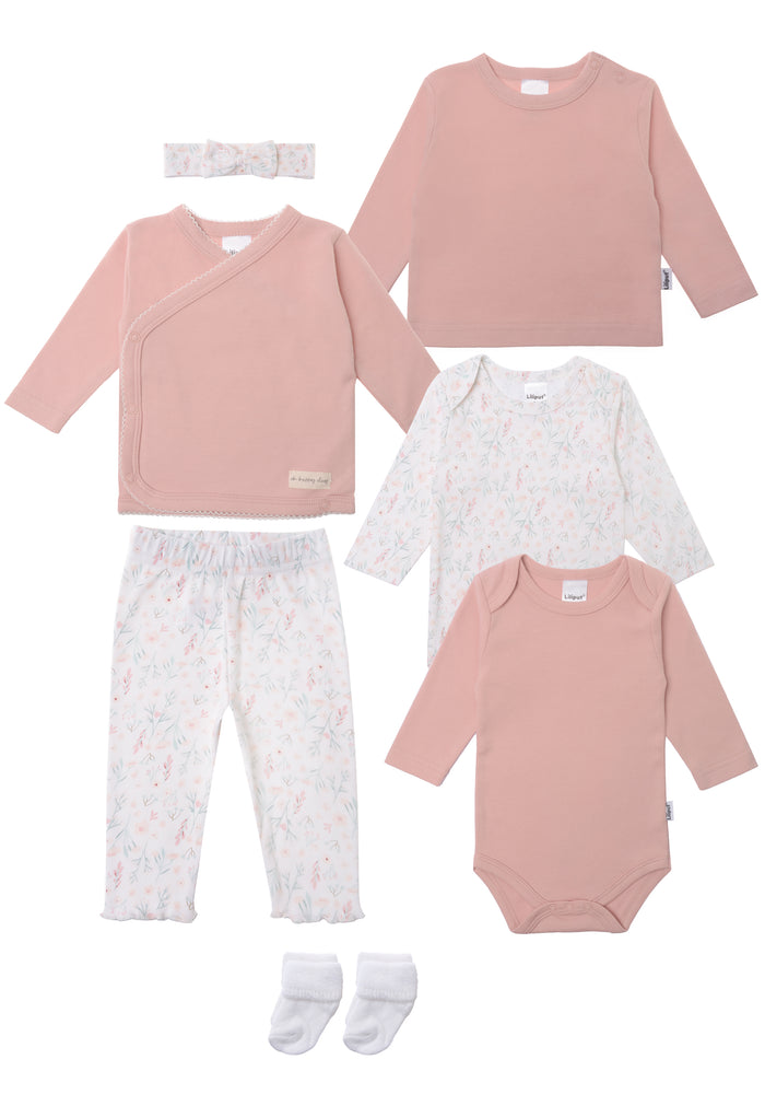 Dieses 8-teilige Baby-Set kombiniert zarte Farben mit liebevollen Details.

