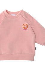 Detailansicht des rosa Sweatshirts mit Happy Smiley Print in Orange und Pink.