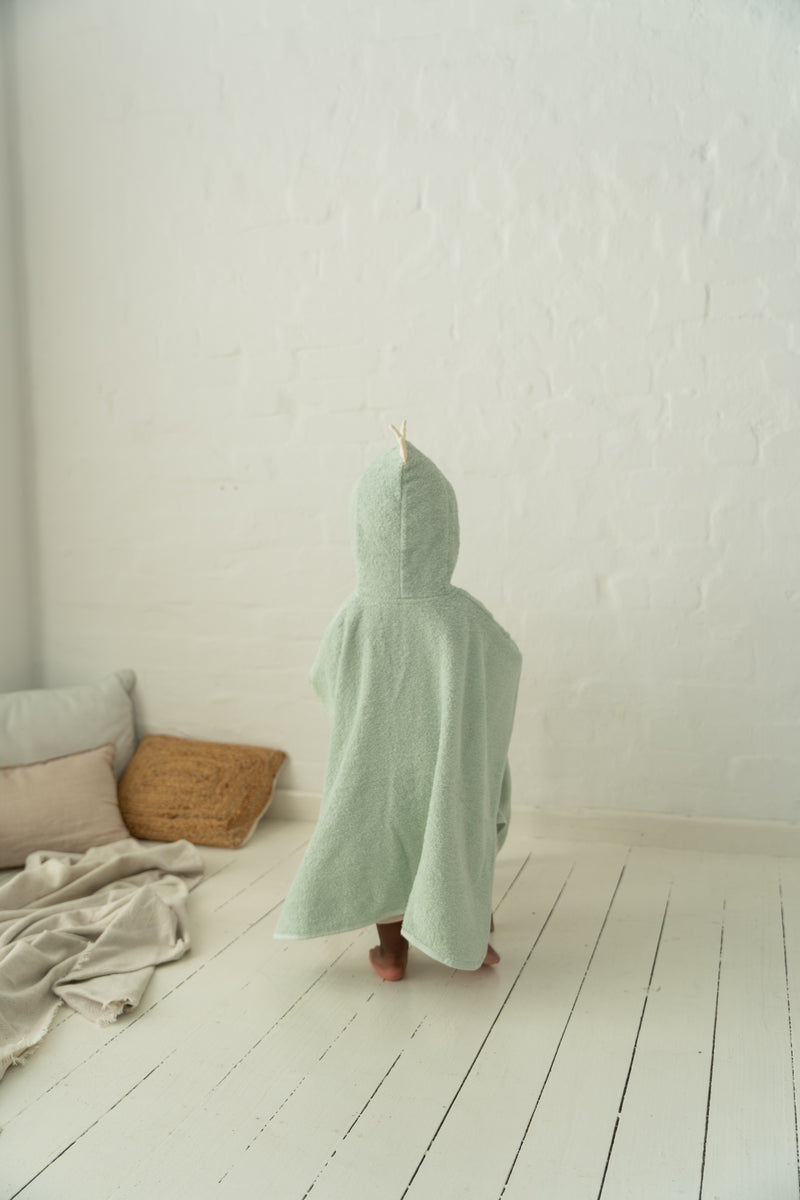 Kapuzenponcho in grün mit Dino-Zacken