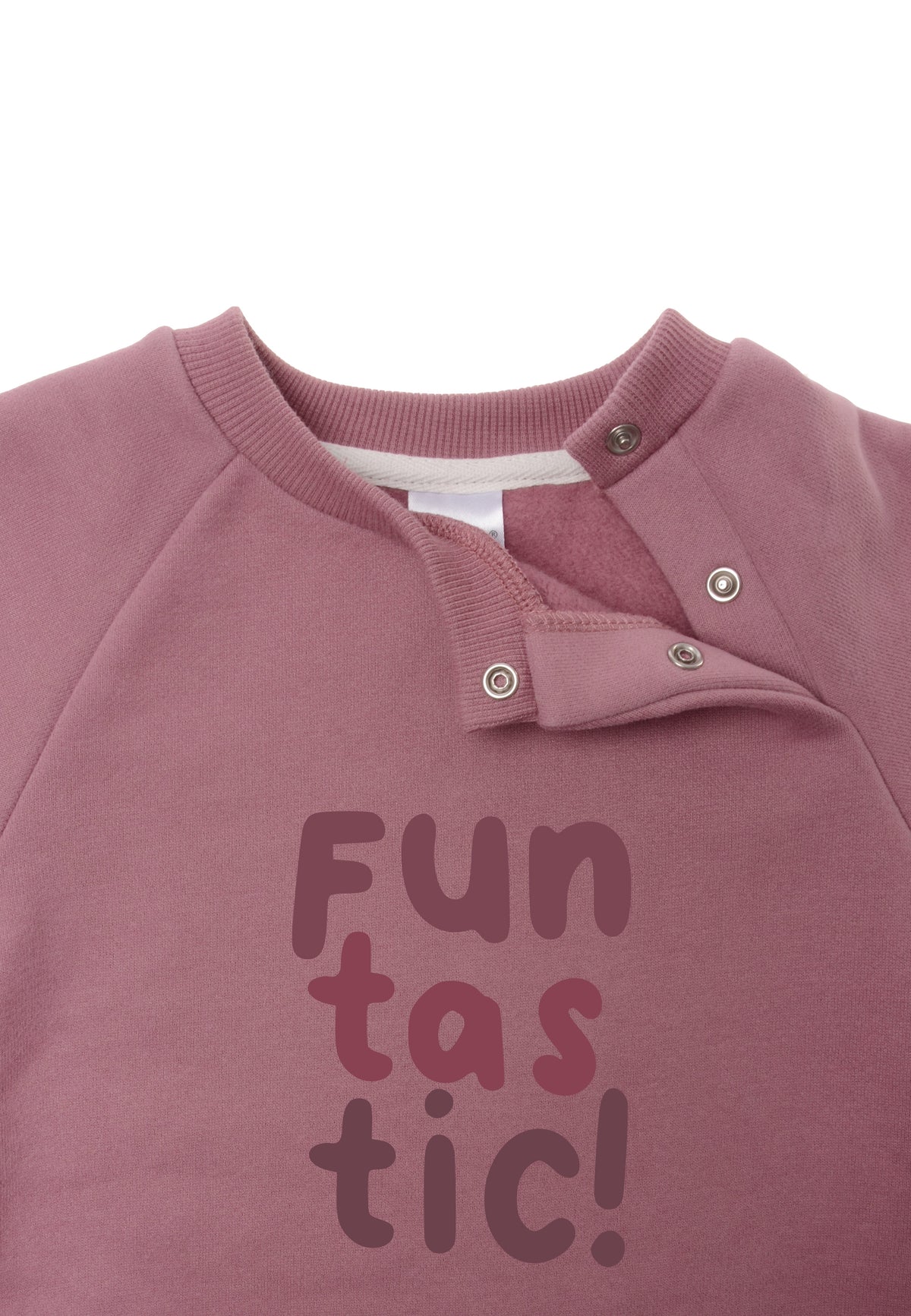 Detailaufnahme mit Druckknöpfen am Halsausschnitt.